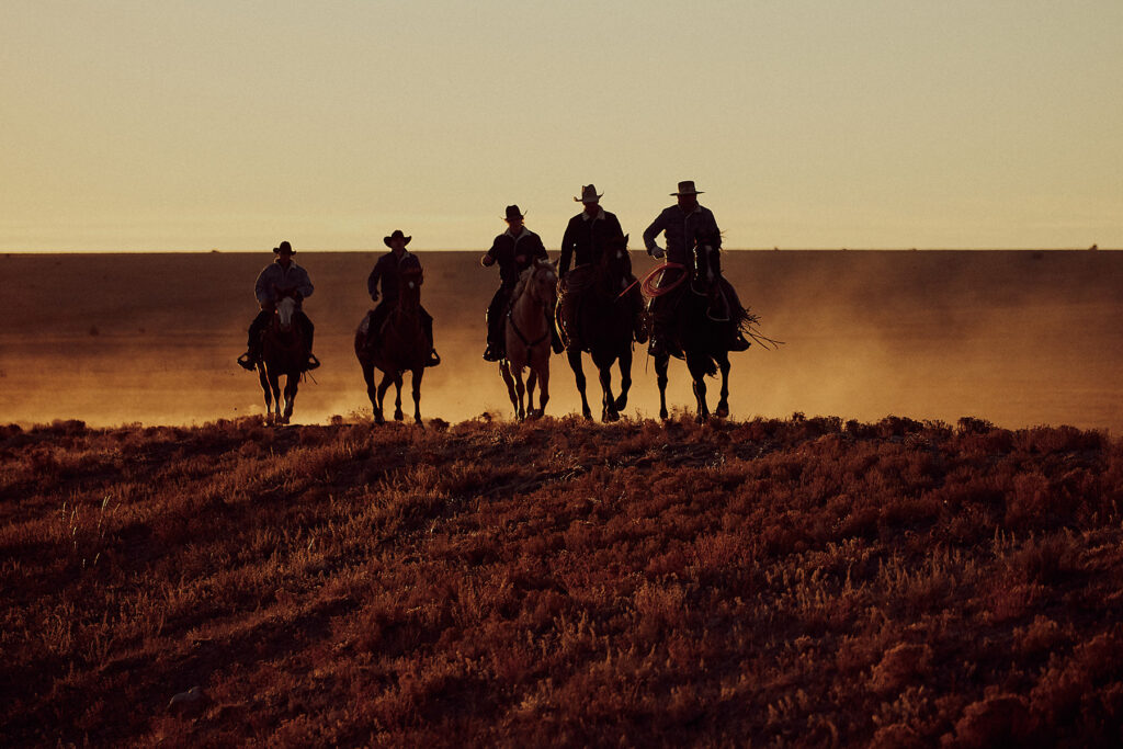 Travis Gillet is a photographer, photographing cowboys and fashion for clients around the world. Like this image taken in Santa Fe of cowboys on horses for Levi's.