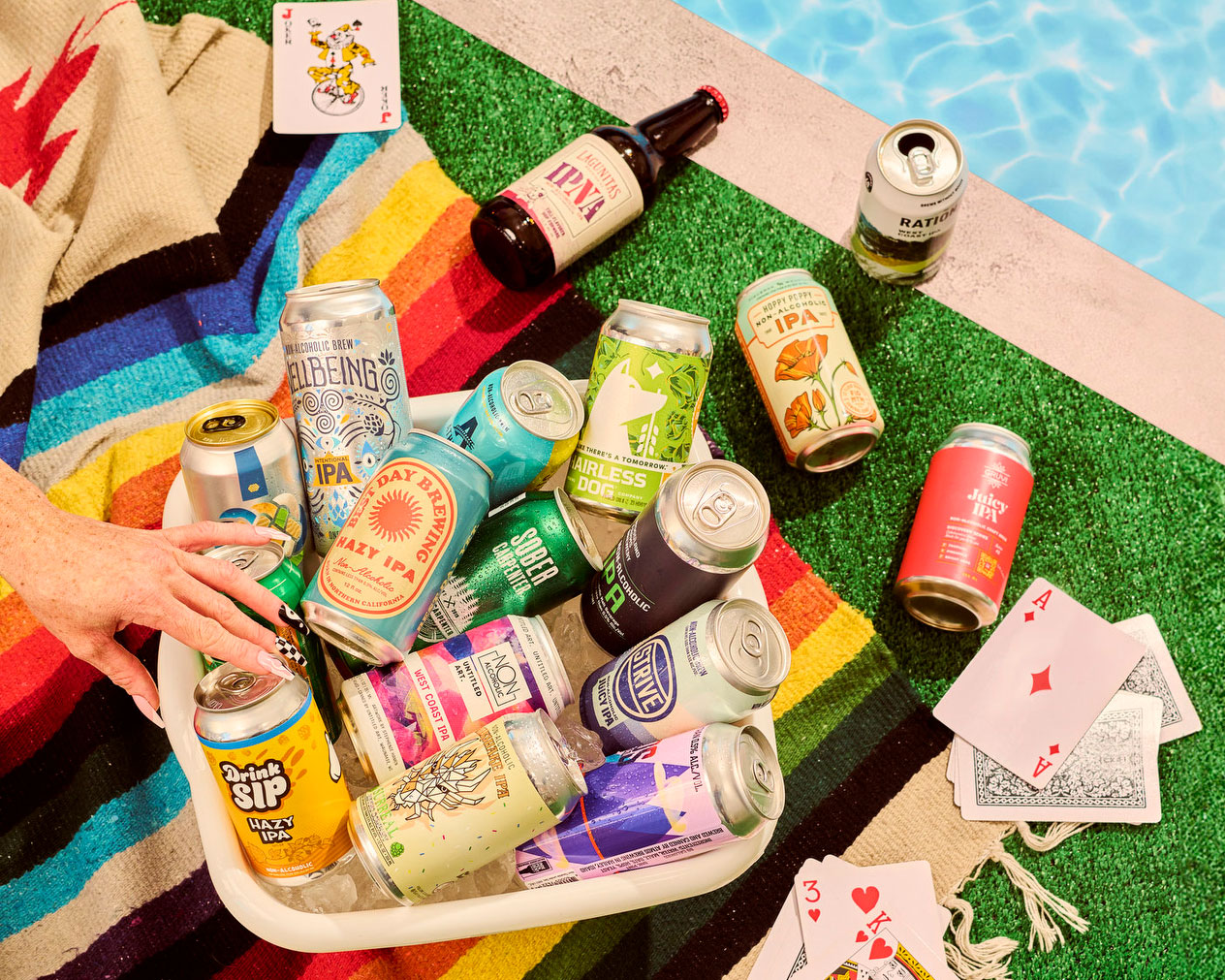 NA beer stacked up in a photograph for the LA Times, sits poolside in Los Angeles.