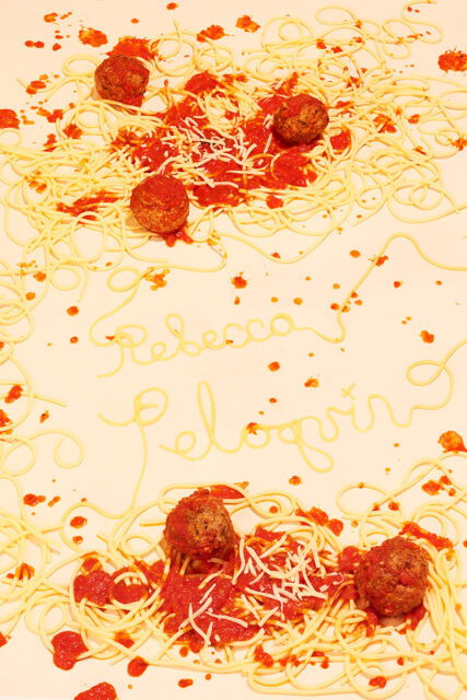 A picture of spaghetti that spells out the name of the photographer, Rebecca Peloquin.